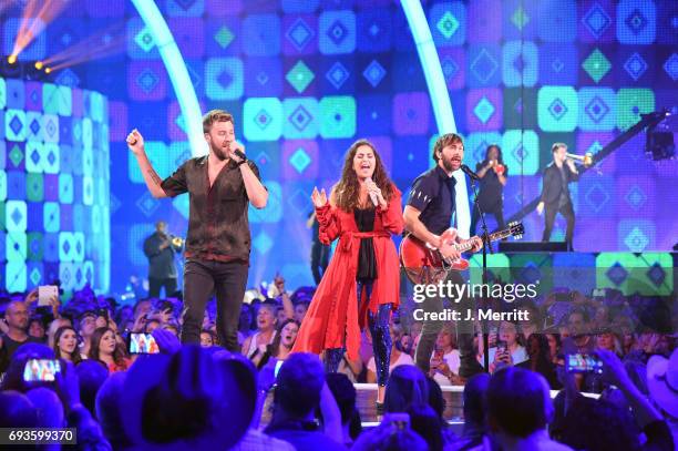 Charles Kelley, Hillary Scott, and Dave Haywood of Lady Antebellum perform onstage at the 2017 CMT Music Awards at the Music City Center on June 7,...