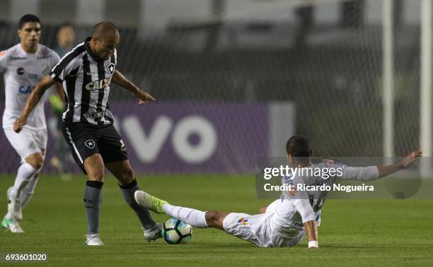 David Braz of Santos battles for the ball with Roger of Botafogo during the match between Santos and Botafogo as a part of Campeonato Brasileiro 2017...