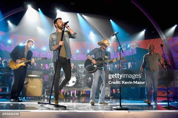 Derek Trucks, Charles Kelley, Jason Aldean, and Darius Rucker perform onstage at the 2017 CMT Music Awards at the Music City Center on June 7, 2017...