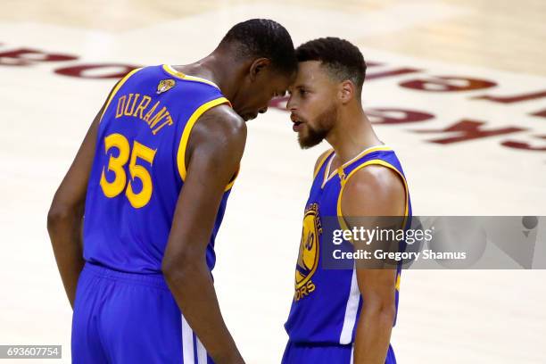 Stephen Curry and Kevin Durant of the Golden State Warriors react late in the game against the Cleveland Cavaliers in Game 3 of the 2017 NBA Finals...