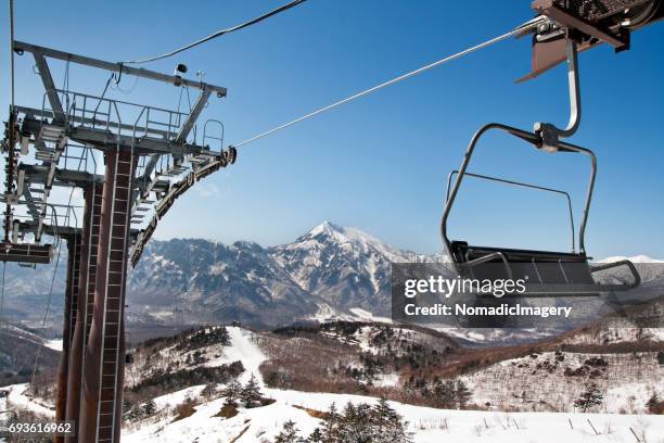 overhead cable car at togakushi winter ski resort - togakushi stock pictures, royalty-free photos & images