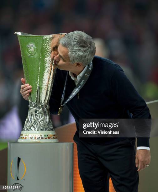 Manchester United coach Jose Mourinho kisses the trophy after the Europa League Final between Manchester United and AFC Ajax at the Friends Arena on...