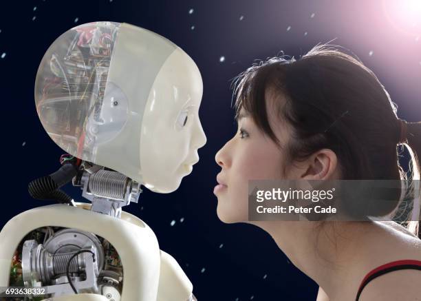 woman and robot face to face - robot imagens e fotografias de stock