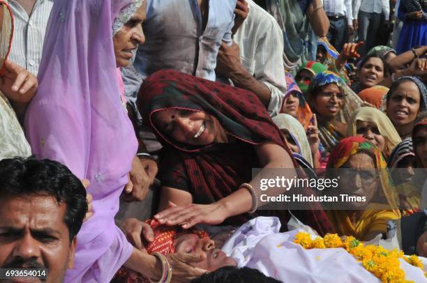 Villagers staging a chakka jam on Mhow-Neemuch highway with the body of Abhishek Patidar who was killed in police firing during farmers protest on...