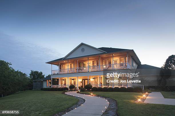 facade of two-story home at night - oklahoma stock pictures, royalty-free photos & images