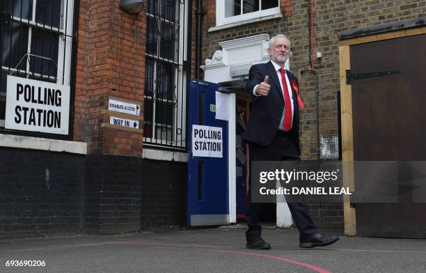 Britain's main opposition Labour Party leader Jeremy Corbyn leaves a polling station after casting his vote in north London on June 8 as Britain...