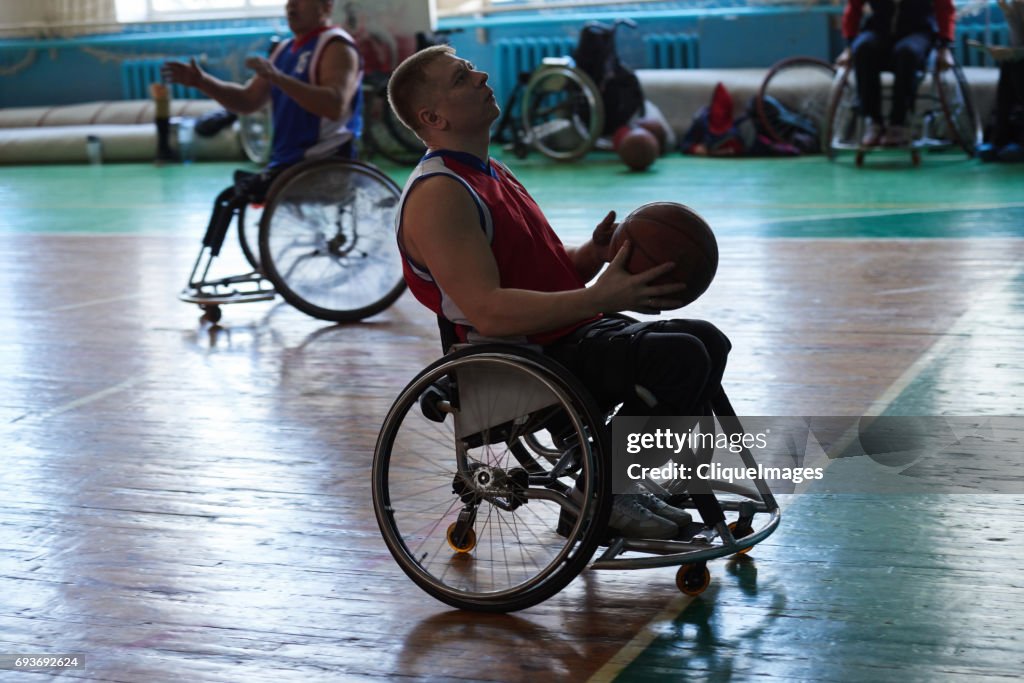Handicapped sportsman with basketball