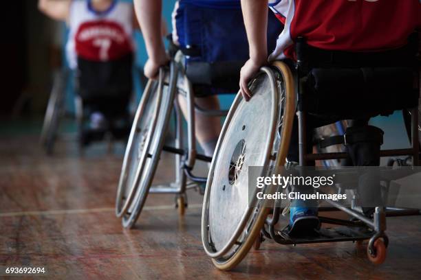 adaptive athletes moving on wheelchairs - adaptive athlete imagens e fotografias de stock