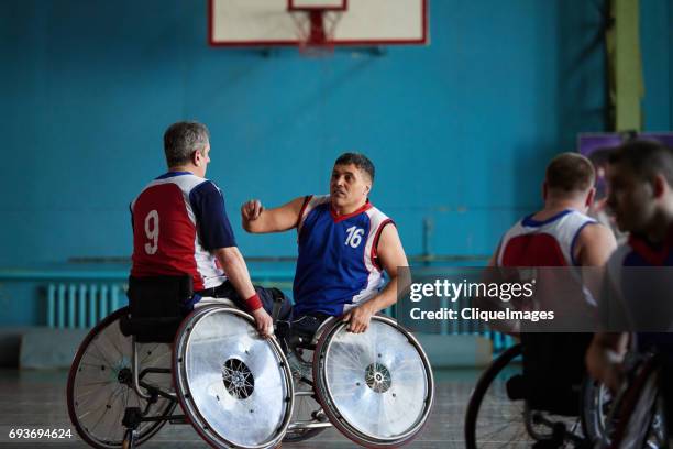 Handicapped basketball players discussing match