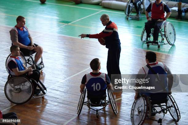 Basketball coach with paraplegic team