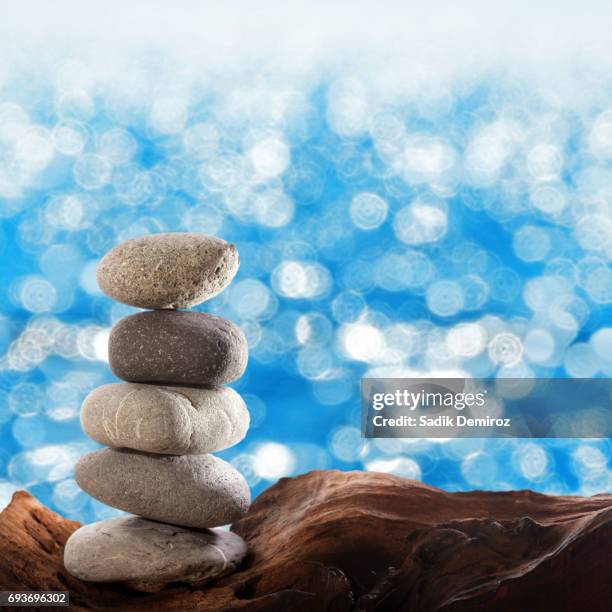 Balane Rocks 84 Rocks Balancing On Driftwood Stock Photos, High-Res Pictures, and ...