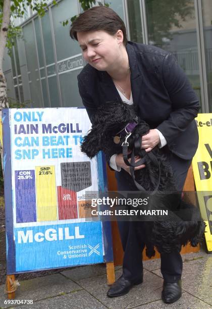 Scottish Conservative leader, Ruth Davidson poses with dog Mister Wilson, outside cafe set up as a Polling Station, in Edinburgh, Scotland, on June 8...