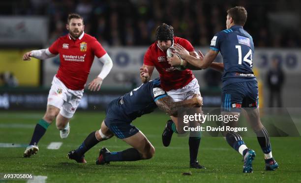 Leigh Halfpenny of the Lions is tackled by Sonny-Bill Williams during the match between the Auckland Blues and the British & Irish Lions at Eden Park...