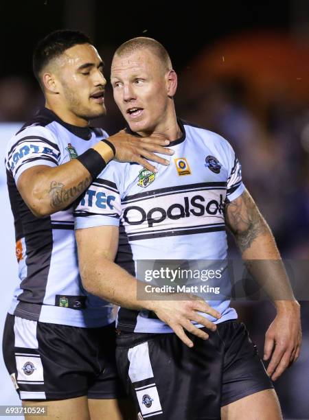 Luke Lewis of the Sharks celebrates with Valentine Holmes of the Sharks after scoring a try during the round 14 NRL match between the Cronulla Sharks...