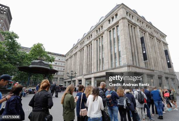 Customers queue outside prior to the opening of the first European 'Saks OFF 5TH' flagship store at Carsch Haus on June 8, 2017 in Duesseldorf,...