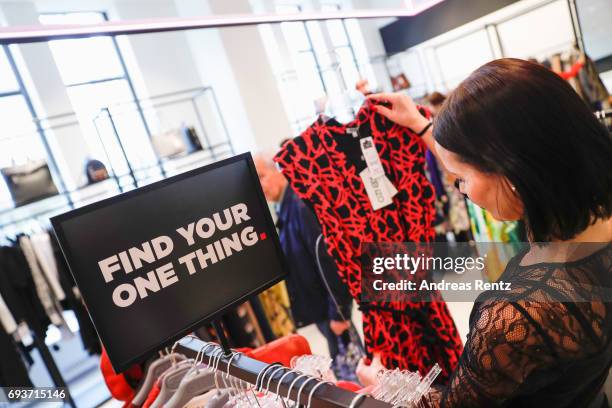 Customer is pictured during the opening of the first European 'Saks OFF 5TH' flagship store at Carsch Haus on June 8, 2017 in Duesseldorf, Germany.