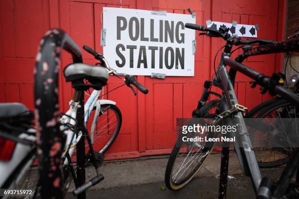 Polling station sign is seen among the bicycles outside a former fire station on June 8, 2017 in London, United Kingdom. Polling stations have opened...