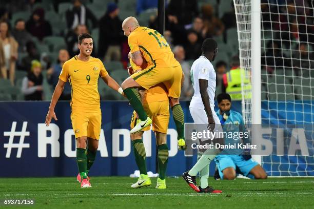 Tomi Juric, Aaron Mooy and Tomas Rogic of Australia celebrate after scoring a goal during the 2018 FIFA World Cup Qualifier match between the...