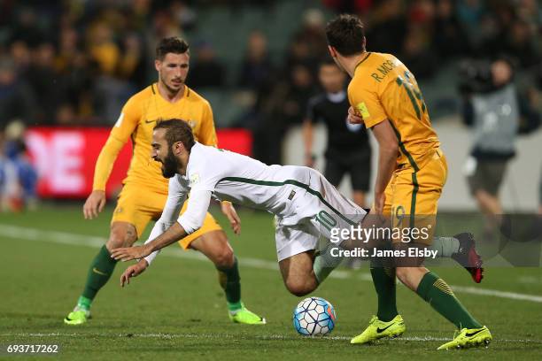 Mohammed Al Sahlawi of Saudi Arabia clashes Ryan McGowan of Australia during the 2018 FIFA World Cup Qualifier match between the Australian Socceroos...