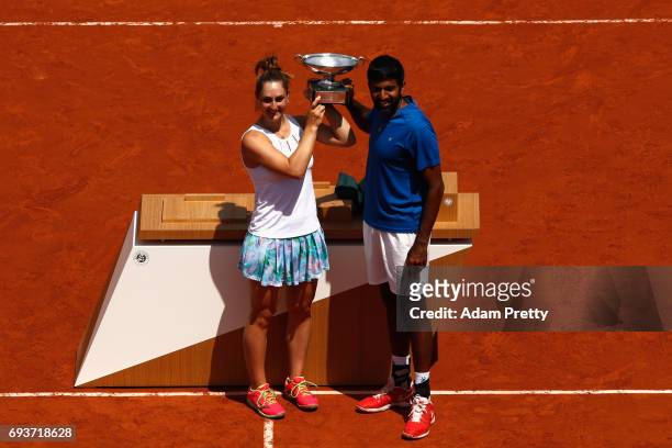 Gabriela Dabrowski of Canada and Rohan Bopanna of India celebrate with the trophy following victory in the mixed doubles final against Anna-Lena...