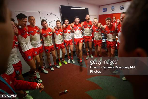 Swans players sing their team song after winning the round 12 AFL match between the Sydney Swans and the Western Bulldogs at Sydney Cricket Ground on...