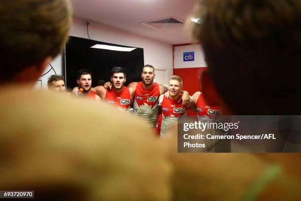 Swans players sing their team song after winning the round 12 AFL match between the Sydney Swans and the Western Bulldogs at Sydney Cricket Ground on...