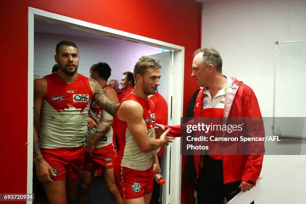 Swans coach John Longmire congratulates Kieren Jack of the Swans after winning the round 12 AFL match between the Sydney Swans and the Western...