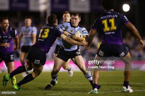 Paul Gallen of the Sharks takes on the defence during the round 14 NRL match between the Cronulla Sharks and the Melbourne Storm at Southern Cross...