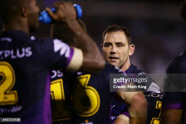 Cameron Smith captain of the Storm talks to players after a Sharks try during the round 14 NRL match between the Cronulla Sharks and the Melbourne...