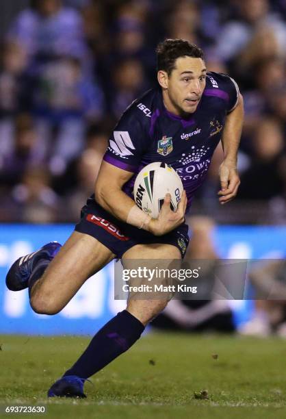 Billy Slater of the Storm runs with the ball during the round 14 NRL match between the Cronulla Sharks and the Melbourne Storm at Southern Cross...