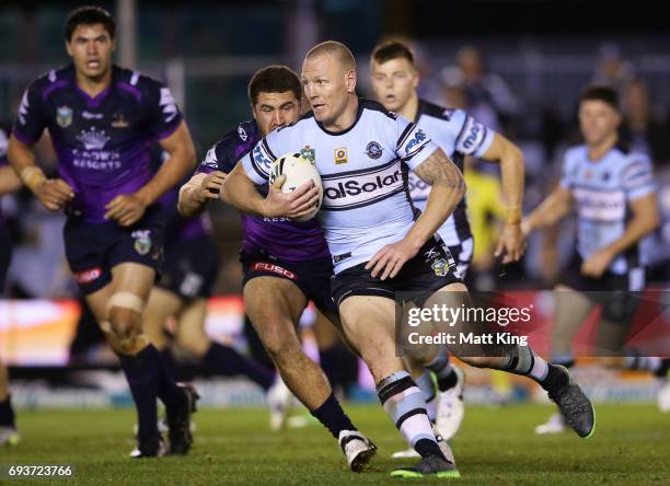 Luke Lewis of the Sharks runs at the defence during the round 14 NRL match between the Cronulla Sharks and the Melbourne Storm at Southern Cross...