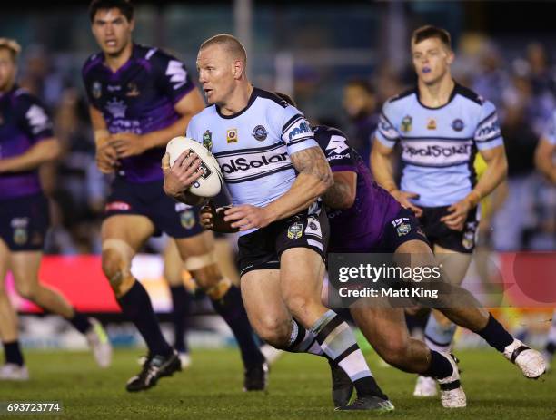 Luke Lewis of the Sharks runs at the defence during the round 14 NRL match between the Cronulla Sharks and the Melbourne Storm at Southern Cross...