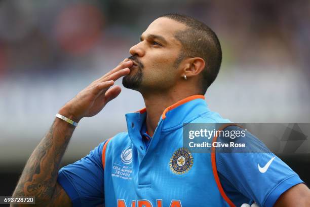 Shikhar Dhawan of India blows a kiss to the crowd as he leaves the field after being dismissed during the ICC Champions trophy cricket match between...