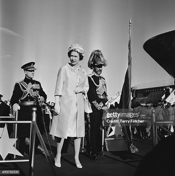 Queen Elizabeth II and the Duke of Edinburgh are greeted by Haile Selassie upon their arrival in Addis Ababa, Ethiopia, February 1965.