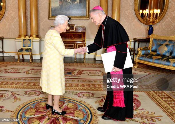 Queen Elizabeth II meets His Excellency Archbishop Edward Joseph Adams, Apostolic nuncio, during a private audience in Buckingham Palace on June 8,...