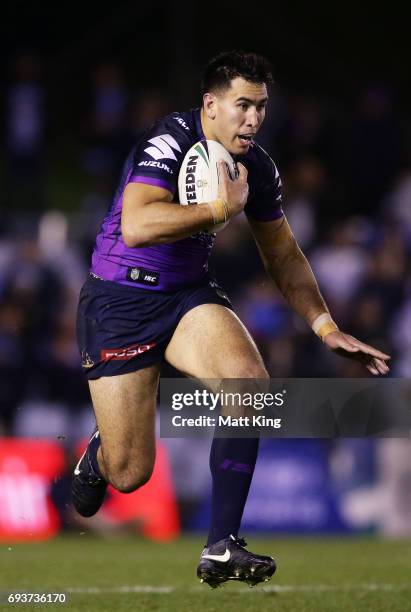 Nelson Asofa-Solomona of the Storm runs with the ball during the round 14 NRL match between the Cronulla Sharks and the Melbourne Storm at Southern...