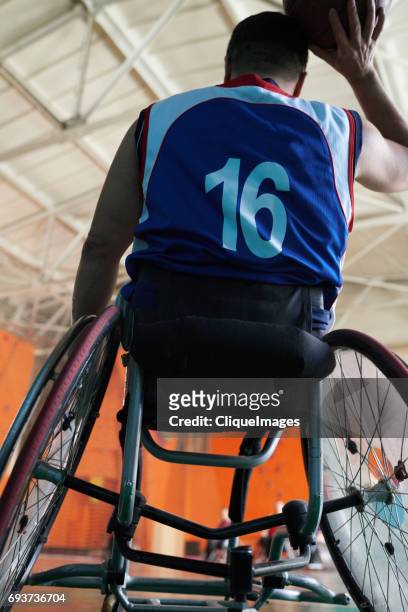 basketball player in wheelchair - cliqueimages stock-fotos und bilder