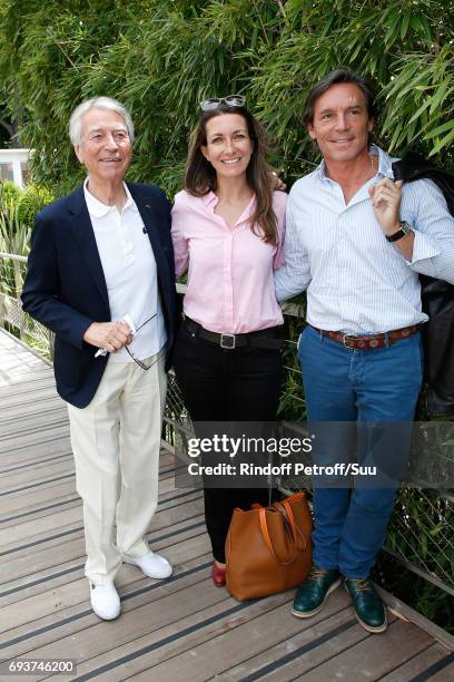 Journalists Jean-Claude Narcy, Anne-Claire Coudray and her companion Nicolas Vix attend the 2017 French Tennis Open - Day Twelve at Roland Garros on...