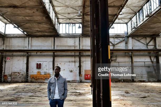 The artist Ibrahim Mahama of Ghana stands in the 'Henschel Hall' with jute bags for his next artwork on June 8, 2017 in Kassel, Germany. The...