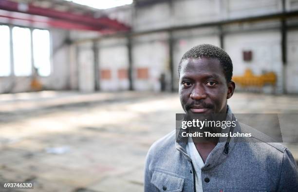 The artist Ibrahim Mahama of Ghana stands in the 'Henschel Hall' with jute bags for his next artwork on June 8, 2017 in Kassel, Germany. The...