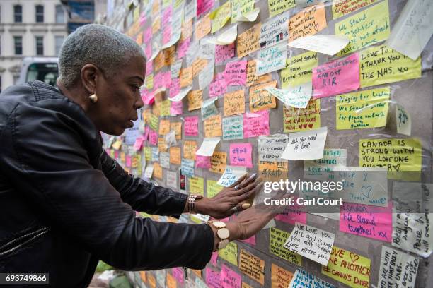 Woman places a message next to other notes on a plinth on London Bridge following Saturday's terror attack, on June 8, 2017 in London, England. Eight...