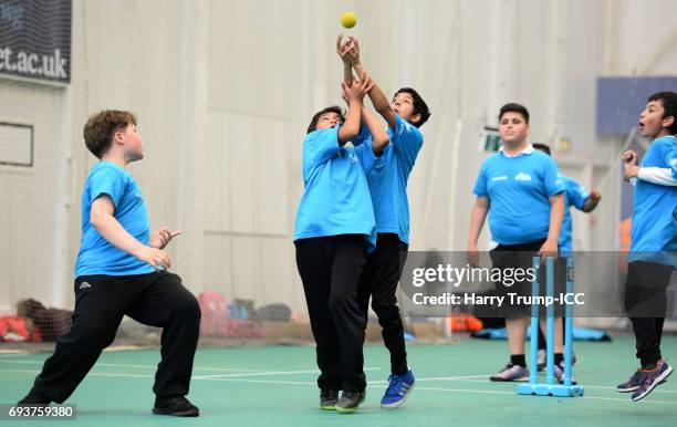 Pupils collide and drop a catch during the ICC Champions Trophy Ambassador - Shane Bond event at SWALEC Stadium on June 8, 2017 in Cardiff, Wales.