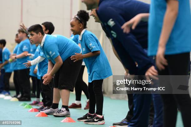 Players and pupils take part in a catching drill during the ICC Champions Trophy Ambassador - Shane Bond event at SWALEC Stadium on June 8, 2017 in...