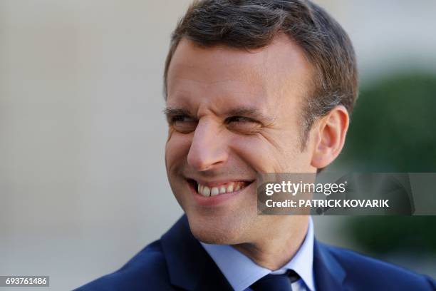 French President Emmanuel Macron is pictured during a joint press conference with the Peruvian president following talks at the Elysee Presidential...