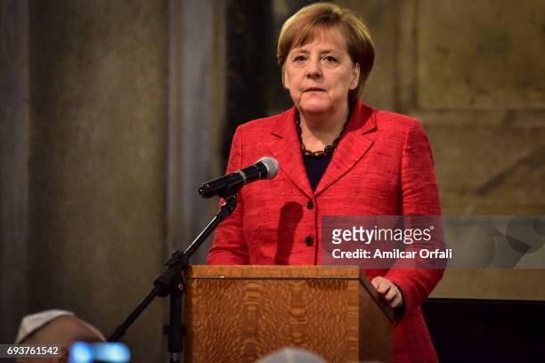 German Chancellor Angela Merkel looks on during the opening ceremony of restored Walcker organ as part of her official visit to Argentina at Templo...