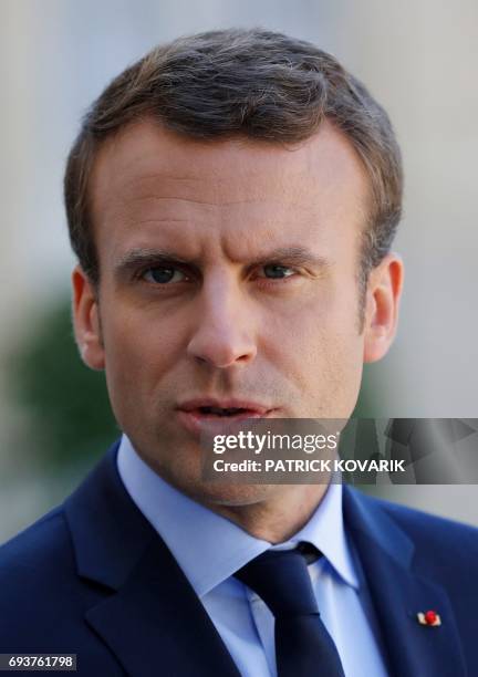 French President Emmanuel Macron addresses a joint press conference with the Peruvian president following talks at the Elysee Presidential Palace in...