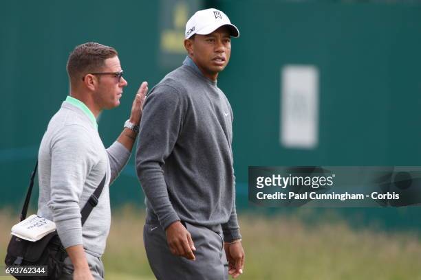 Tiger Woods at the 18th hole with coach Sean Foley during a practice round of The Open Championship 2013 at Muirfield Golf Club on July 15, 2013 in...