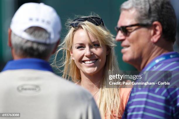 Lindsey Vonn chats with Fred Couples during the first round of The Open Championship 2013 at Muirfield Golf Club on July 17, 2013 in Scotland.