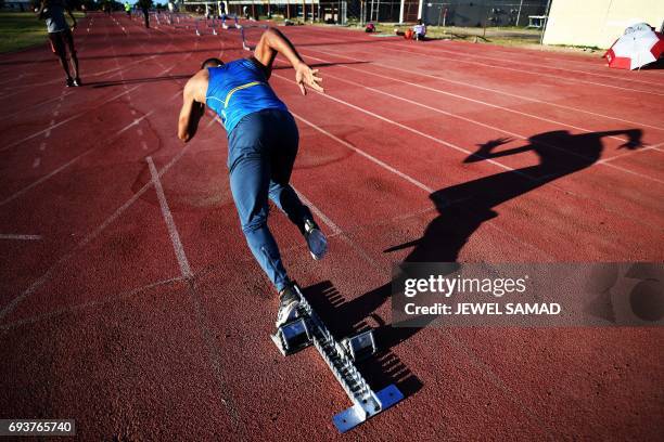 Local sprinter trains in an outfield track at the national stadium in Kingston, Jamaica, on June 8, 2017. Usain Bolt's imminent retirement is a blow...