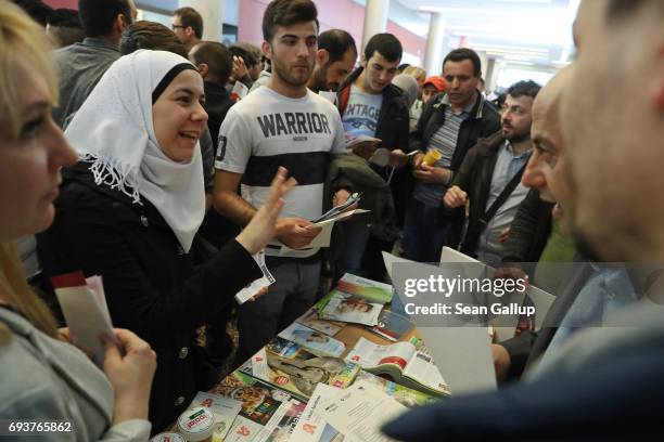 People attend a jobs fair announced specifically for refugees at the Occupation Information Center Berlin-Mitte, part of Germany's Federal Agency for...